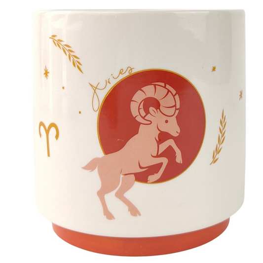 Ceramic mug with Aries zodiac design on a white background