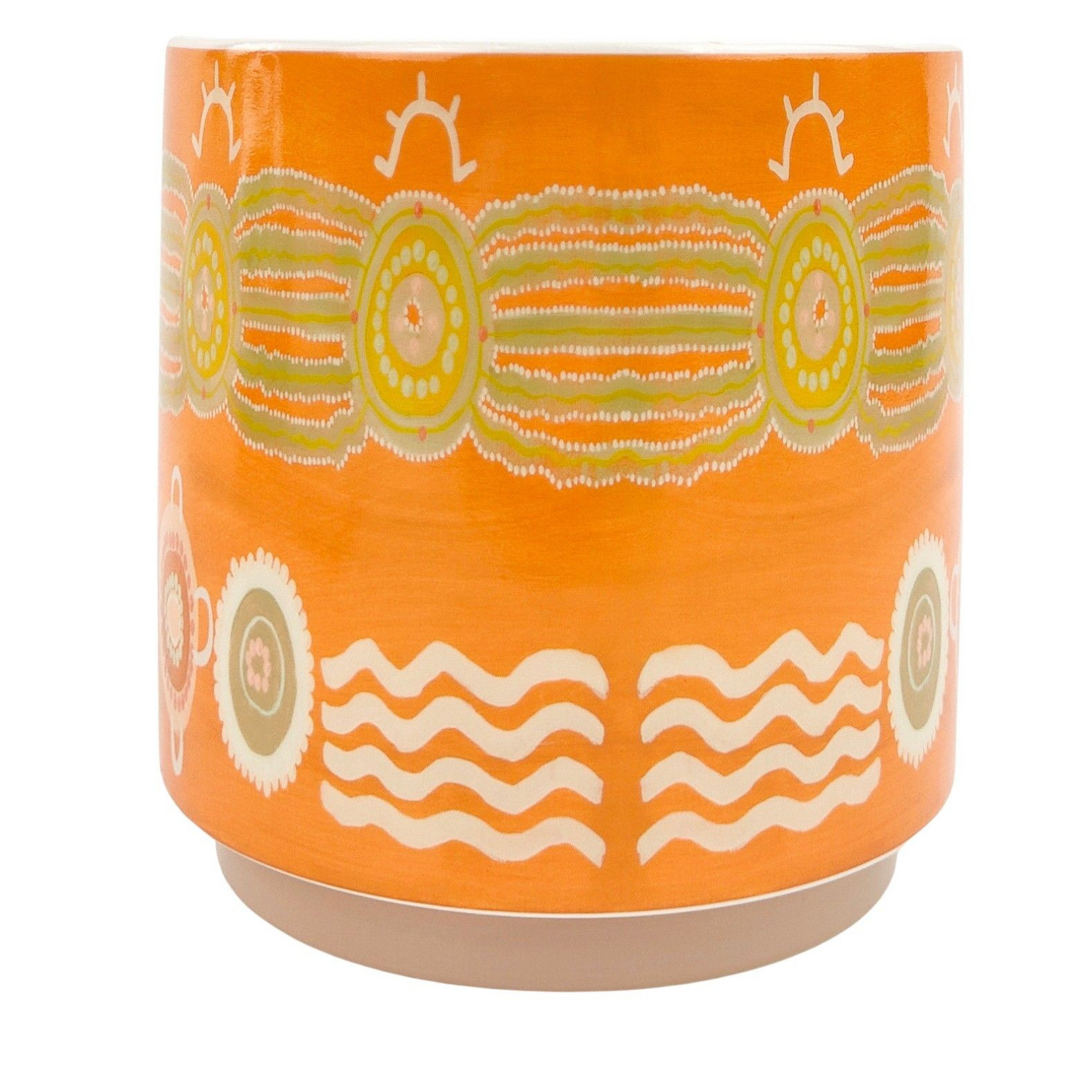 Orange ceramic pot with decorative patterns on a white background